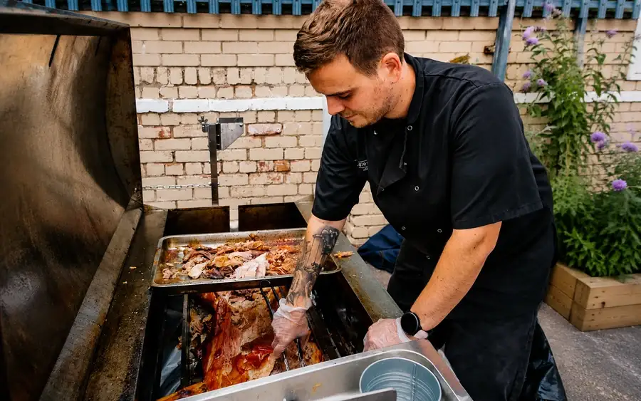 Hog roast served with baby roast potatoes, salads and coleslaw