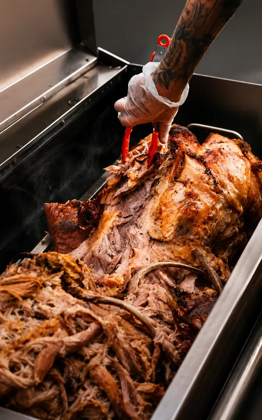 Whole hog roasting on a spit with crisp crackling