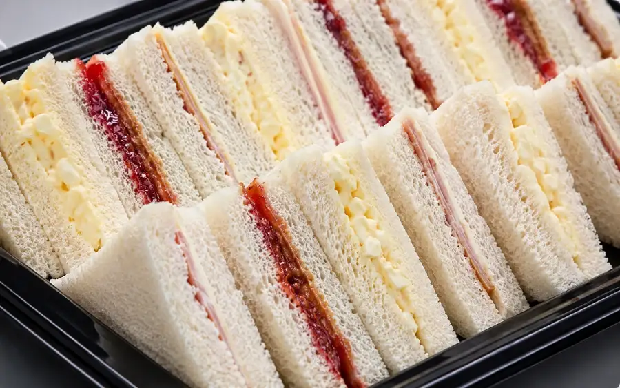 Fresh fruit portions, yoghurt tubes and breadsticks arranged for young diners